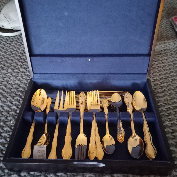 NOT FOR SALE.Like new. International Gold Plated Flatware Set
